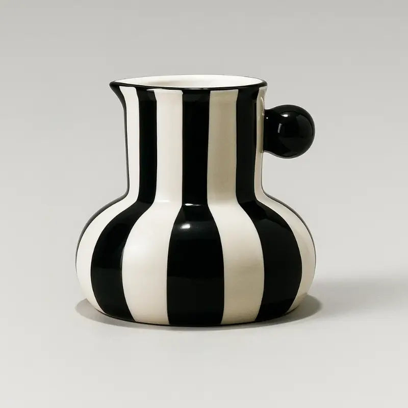 Collection of striped ceramic pitcher vases in green red blue black and yellow with flowers